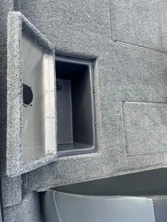 Slide: The Image of 2025 Tracker Pro Team 175 TXW® boat storage compartment with open lid. - 17