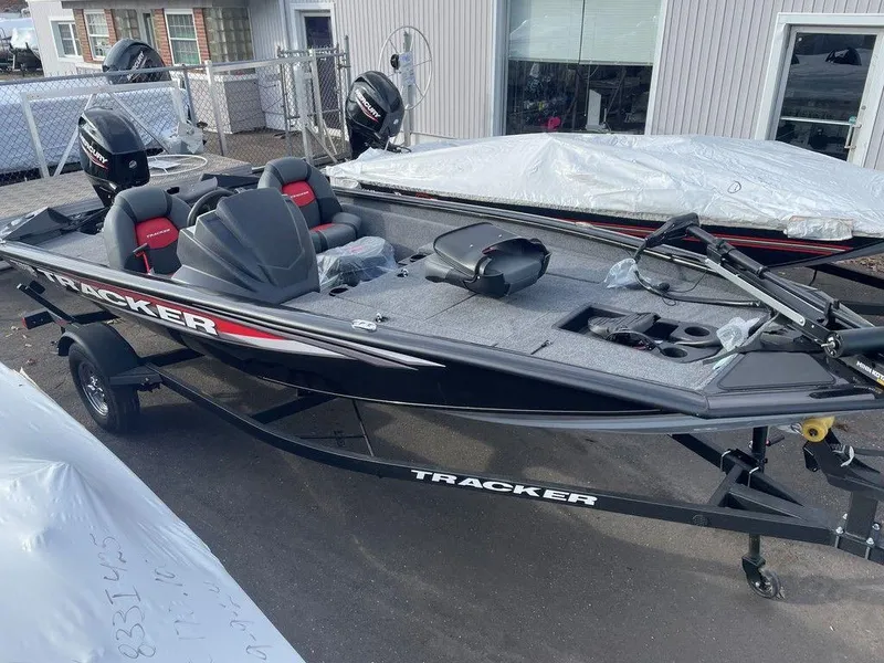 Slide: The Image of 2025 Tracker Pro Team 175 TXW® fishing boat, black exterior, parked outdoors. - 3