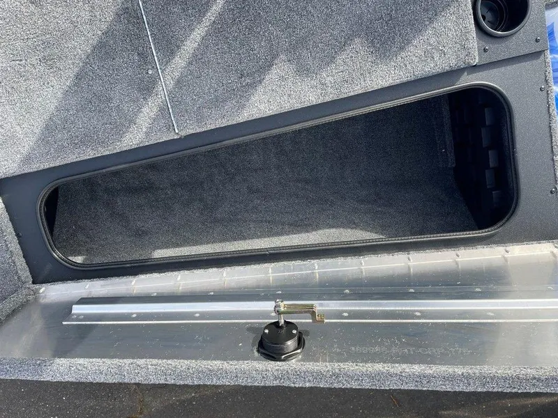 Slide: The Image of 2025 Tracker Pro Team 175 TXW® boat storage compartment, open and empty. - 7