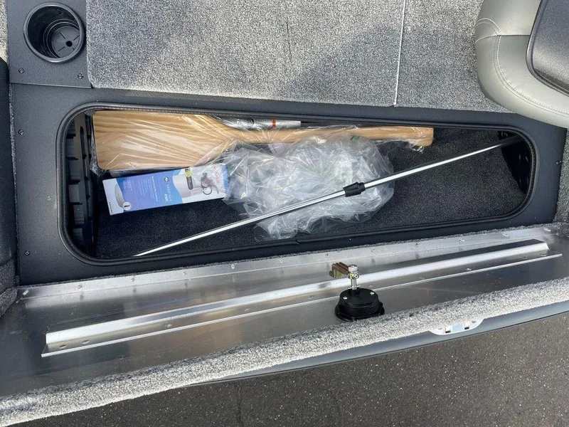 Slide: The Image of Storage compartment of 2025 Tracker Pro Team 175 TXW® boat with fishing gear. - 8