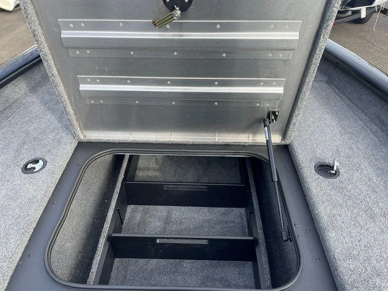 Slide: The Image of Open storage compartment of 2025 Tracker Pro Team 175 TXW® boat. - 9