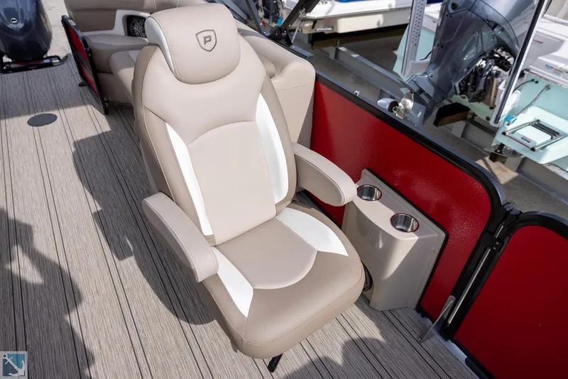 Slide: The Image of Luxurious seating on 2025 Premier 250 Solaris RF boat with cup holders. - 12