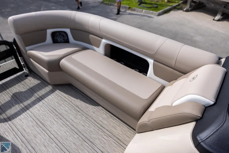 Slide: The Image of 2025 Premier 250 Solaris RF boat interior with beige seating and modern design. - 13