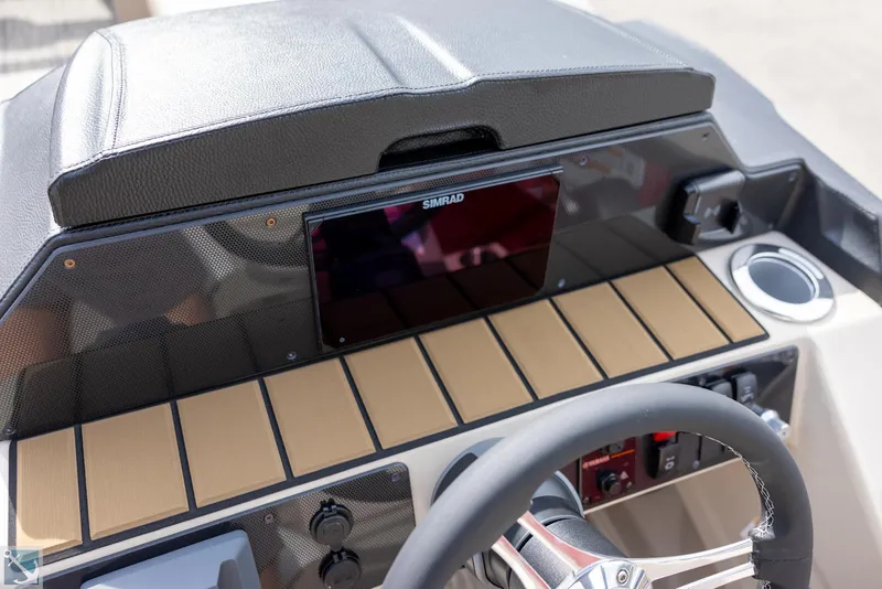 Slide: The Image of 2025 Premier 250 Solaris RF boat dashboard with Simrad display and modern controls. - 16
