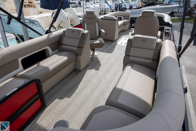 Slide: The Image of 2025 Premier 250 Solaris RF boat interior with beige seating and modern design. - 6
