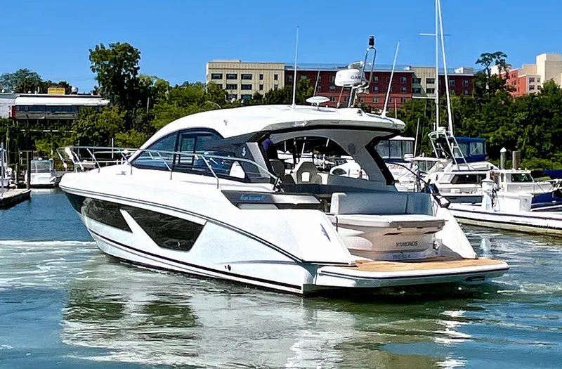 Slide: The Image of 2023 Beneteau Gran Turismo 41 yacht docked in marina, sunny day. - 10