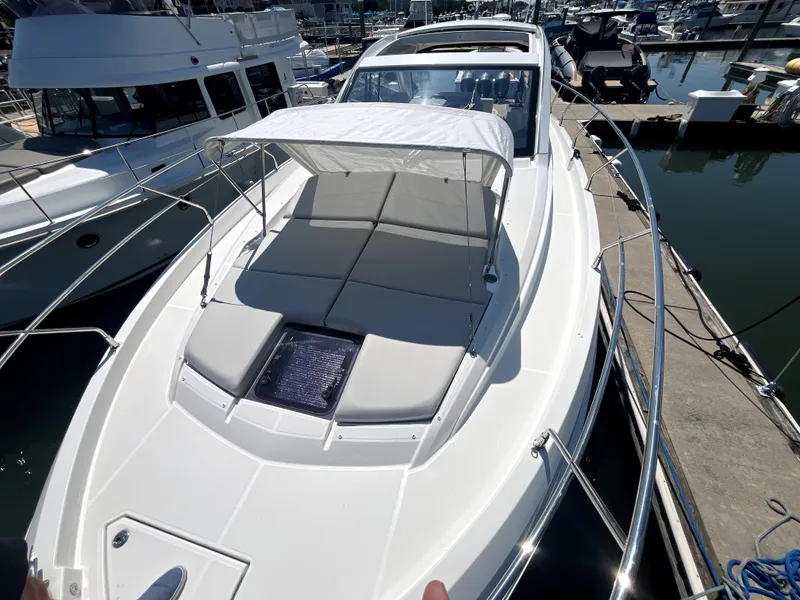 Slide: The Image of 2023 Beneteau Gran Turismo 41 yacht with sunshade, docked at marina. - 15