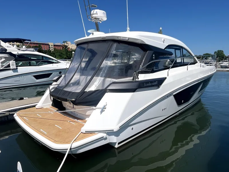 Slide: The Image of 2023 Beneteau Gran Turismo 41 yacht docked in marina, sleek design, sunny day. - 17
