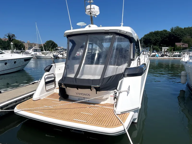 Slide: The Image of 2023 Beneteau Gran Turismo 41 yacht docked at marina, rear view. - 18