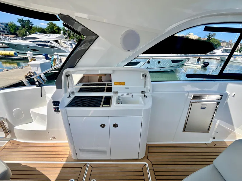 Slide: The Image of Interior of 2023 Beneteau Gran Turismo 41 yacht with sleek kitchenette and modern design. - 22