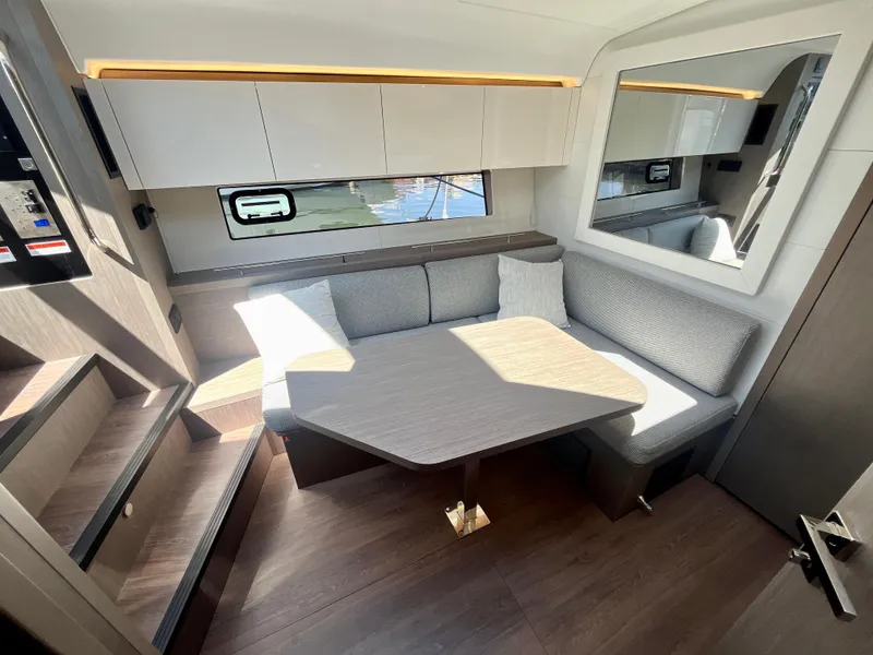 Slide: The Image of Luxurious interior of 2023 Beneteau Gran Turismo 41 yacht with modern seating and table. - 26