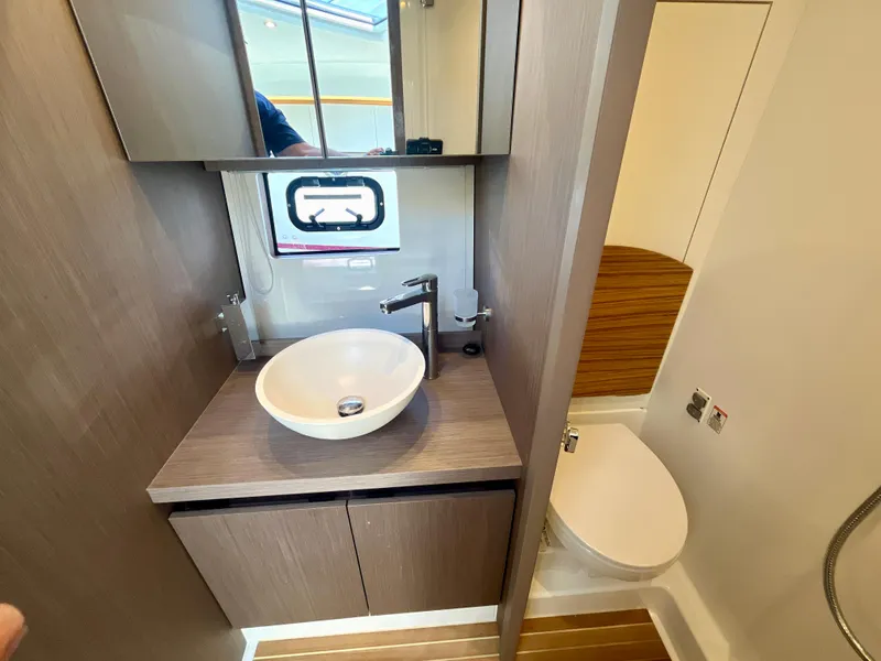 Slide: The Image of Modern bathroom in 2023 Beneteau Gran Turismo 41 yacht with sleek sink and toilet. - 28