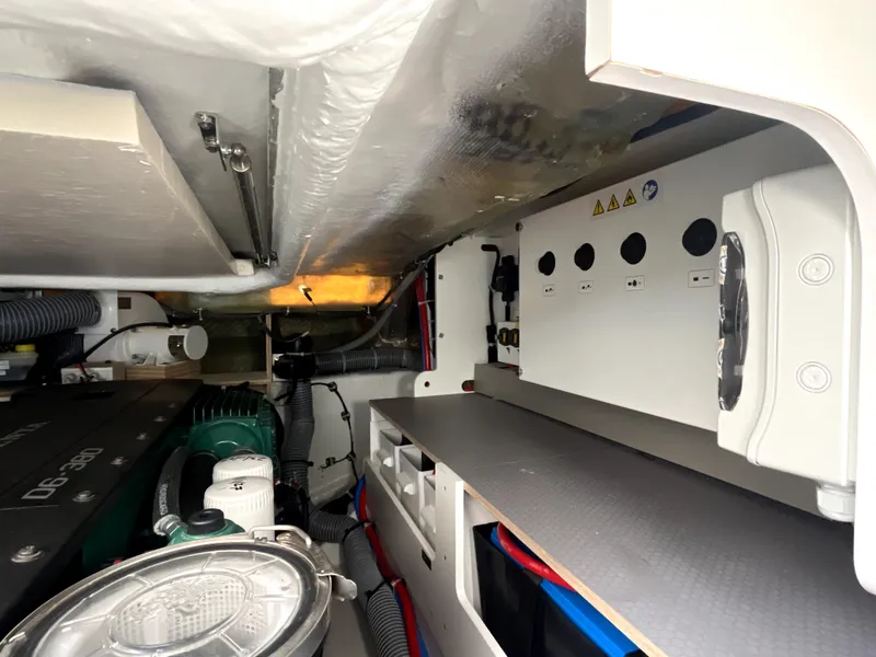 Slide: The Image of Engine room of 2023 Beneteau Gran Turismo 41, showcasing mechanical components and wiring. - 31