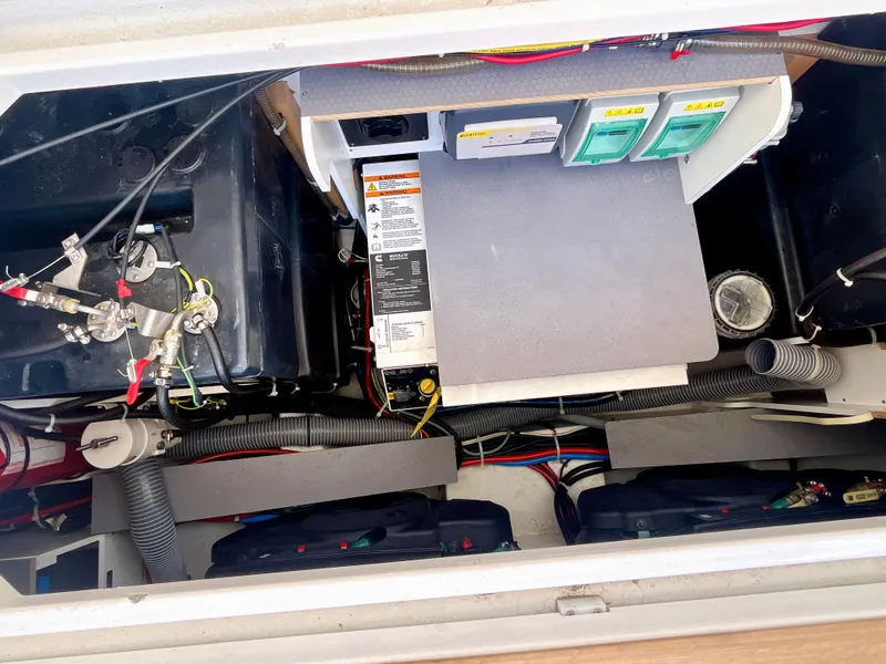 Slide: The Image of Engine compartment of 2023 Beneteau Gran Turismo 41, showcasing wiring and components. - 32