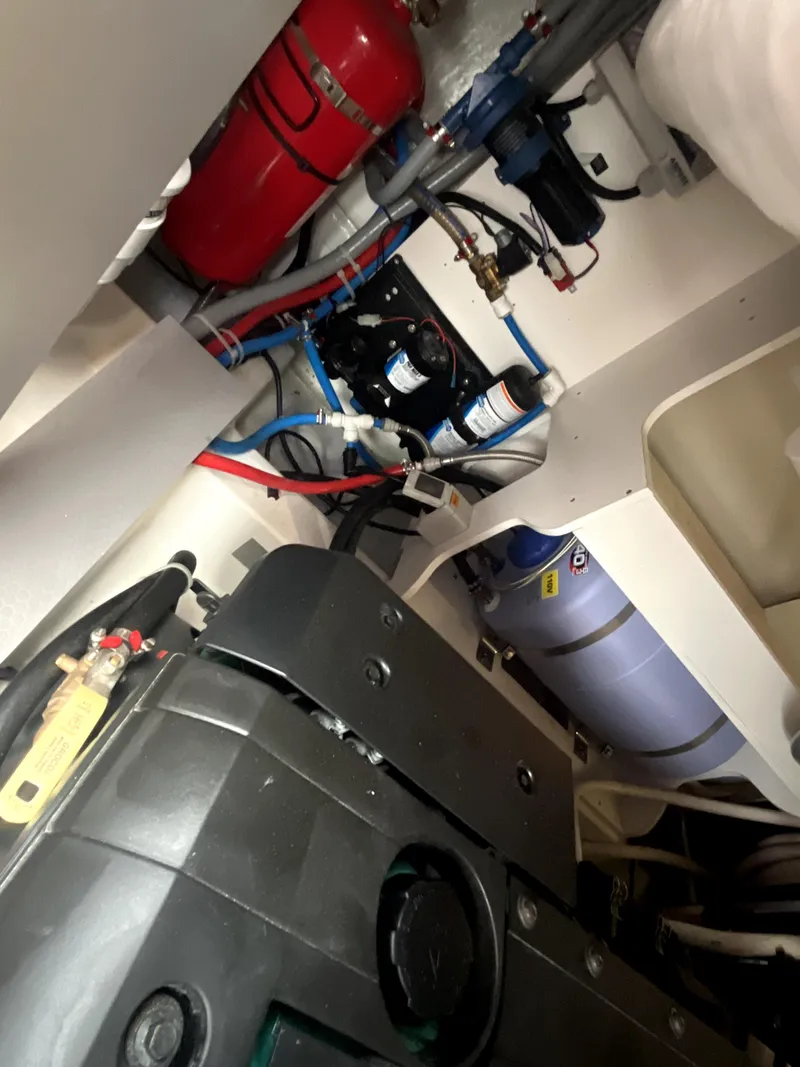 Slide: The Image of Engine room of 2023 Beneteau Gran Turismo 41 with visible components and wiring. - 33