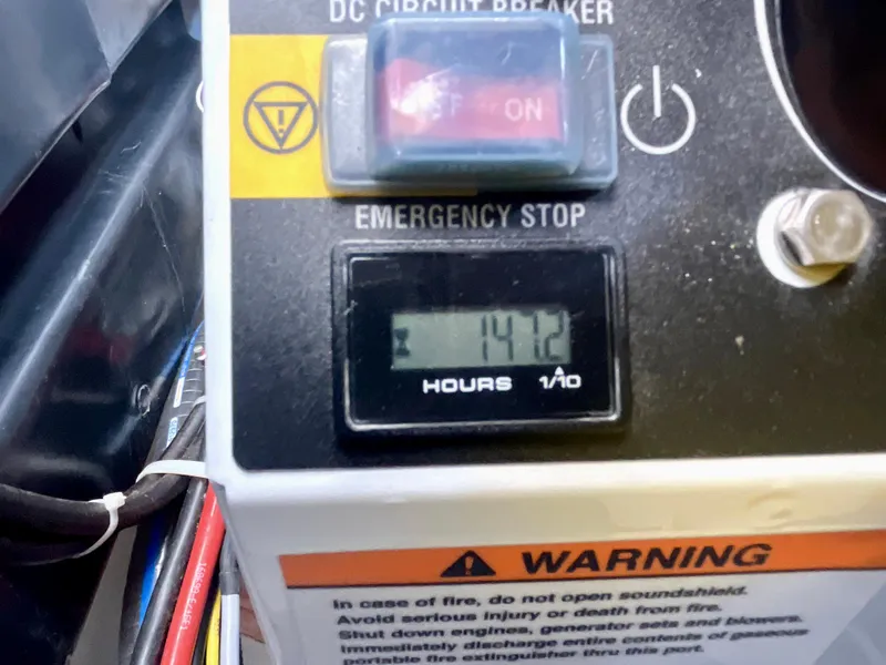 Slide: The Image of Close-up of Beneteau Gran Turismo 41 control panel, showing 141.2 hours on the meter. - 34