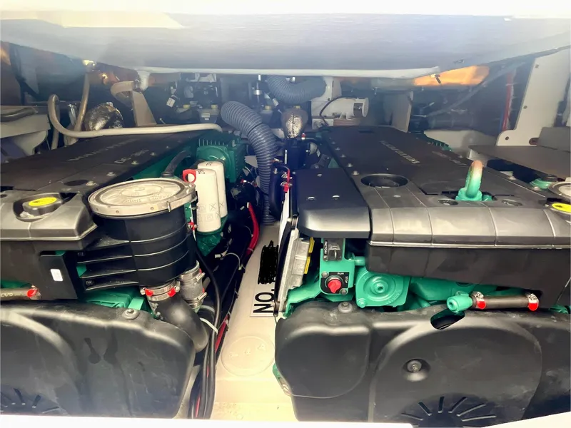 Slide: The Image of Engine room of 2023 Beneteau Gran Turismo 41, showcasing dual engines and mechanical components. - 35