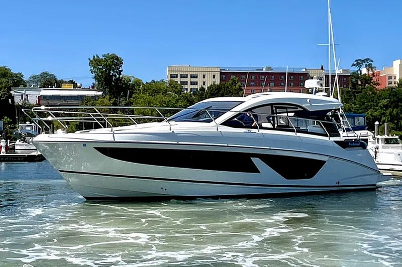 Slide: The Image of 2023 Beneteau Gran Turismo 41 yacht on a sunny day in a marina. - 7