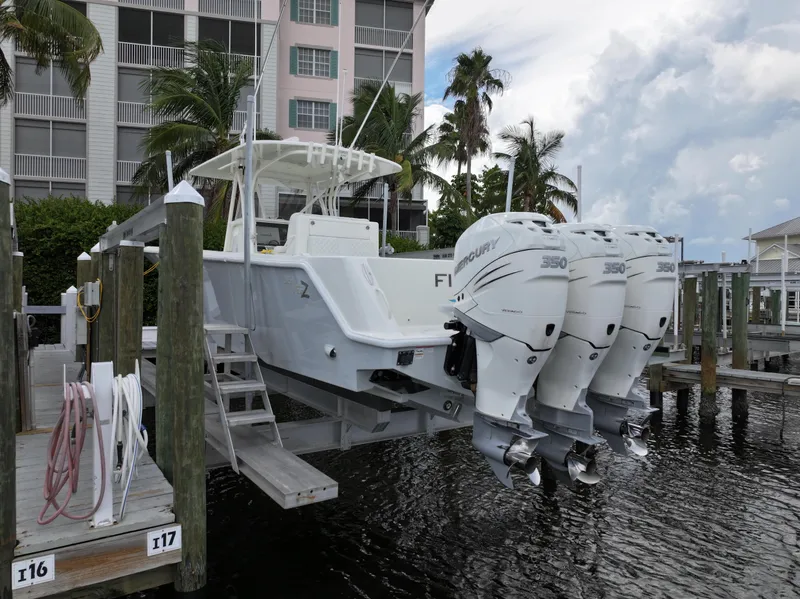 The Image of 2017 SeaVee 370z boat docked with triple outboard engines. - 0