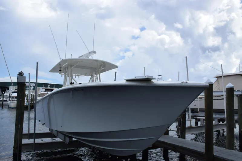 Slide: The Image of 2017 SeaVee 370z boat docked at marina under cloudy sky. - 10