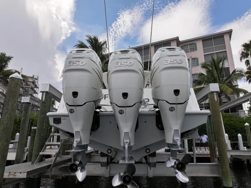 Slide: The Image of 2017 SeaVee 370z boat with triple 350 horsepower engines docked at marina. - 12