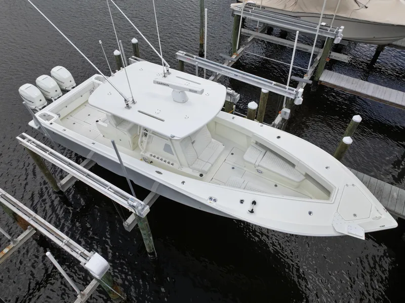 Slide: The Image of Aerial view of 2017 SeaVee 370z boat docked with triple outboard engines. - 15