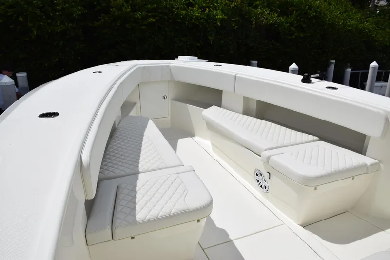 Slide: The Image of 2017 SeaVee 370z boat interior with white cushioned seating. - 17