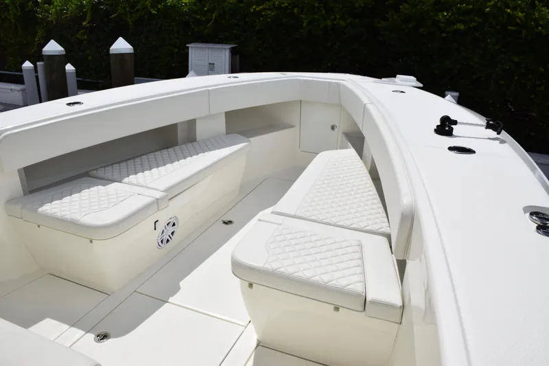 Slide: The Image of 2017 SeaVee 370z boat interior with white cushioned seating and sleek design. - 18