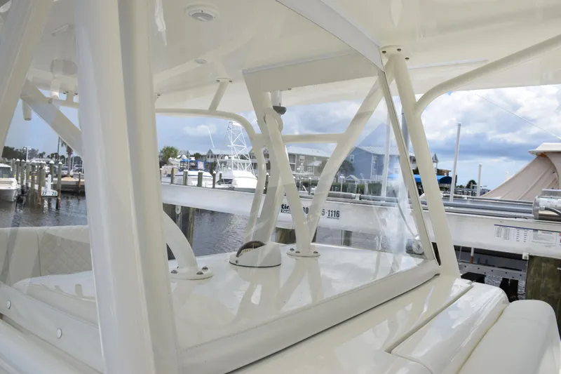 Slide: The Image of 2017 SeaVee 370z boat interior with marina view, showcasing sleek design and structure. - 24