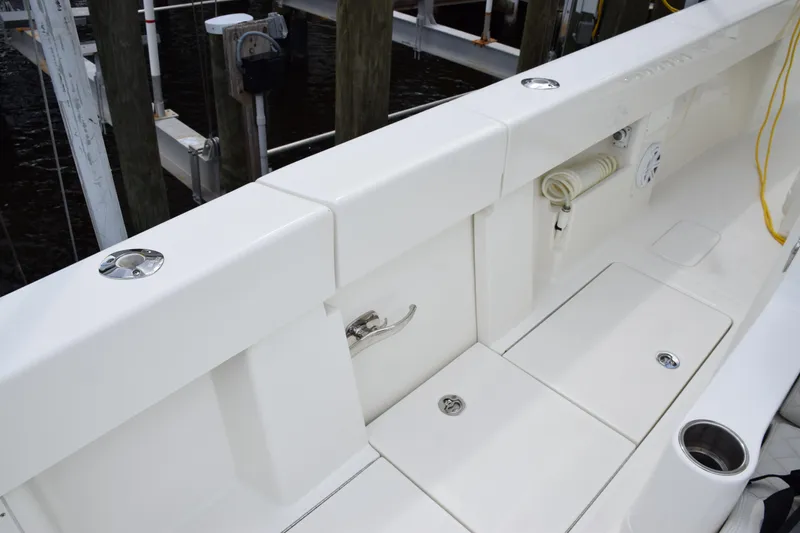 Slide: The Image of 2017 SeaVee 370z boat deck with storage compartments and rod holders. - 29