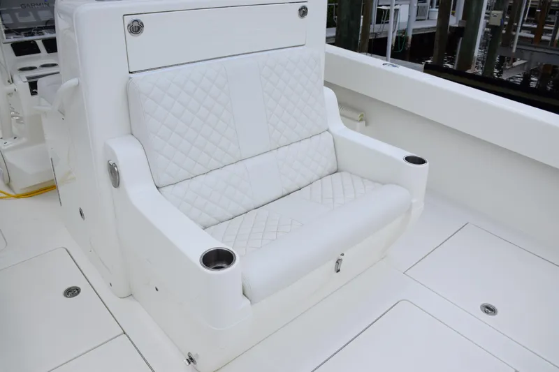 Slide: The Image of Luxurious white seating on 2017 SeaVee 370z boat with quilted design and cup holders. - 30