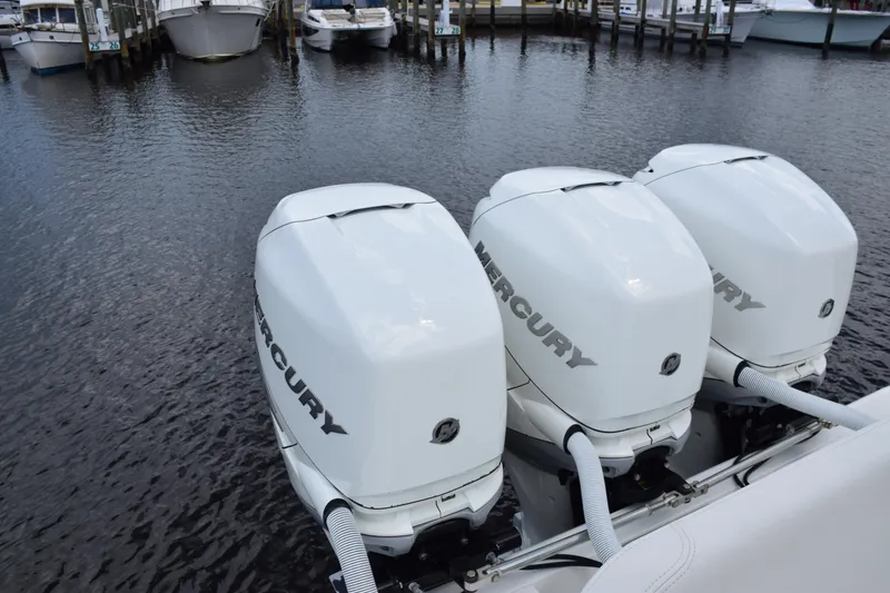 Slide: The Image of 2017 SeaVee 370z with triple Mercury outboard engines docked at marina. - 35