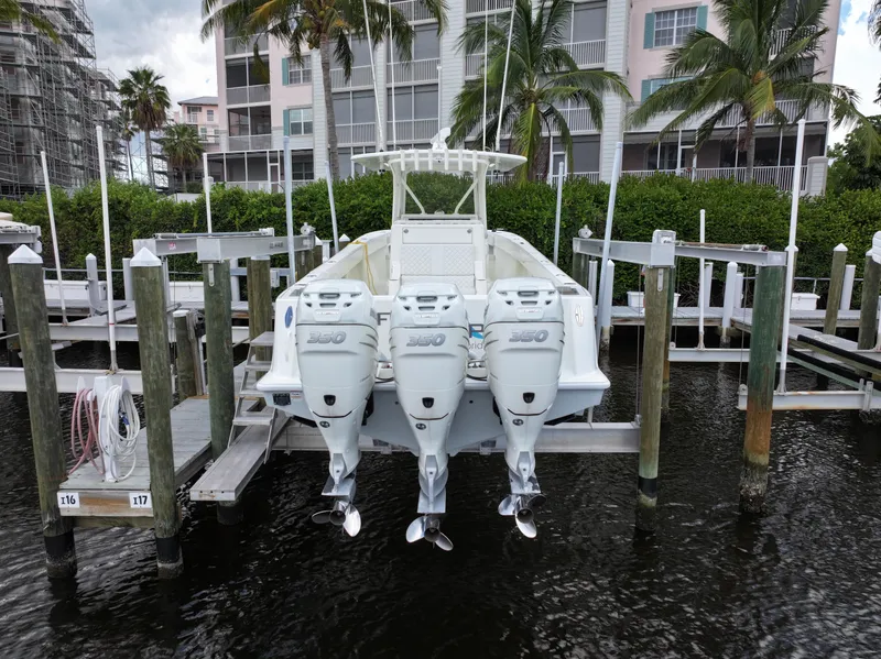 Slide: The Image of 2017 SeaVee 370z boat with triple outboard engines docked at marina. - 6
