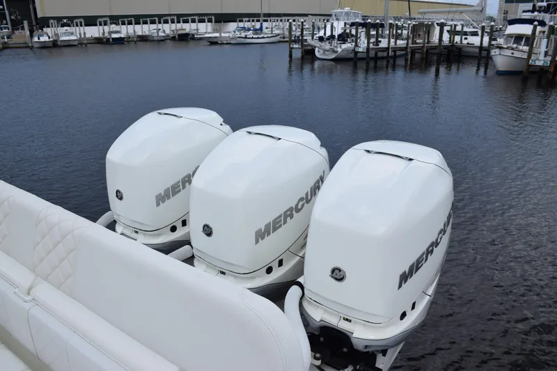 Slide: The Image of 2017 SeaVee 370z boat with triple Mercury outboard engines docked at marina. - 7