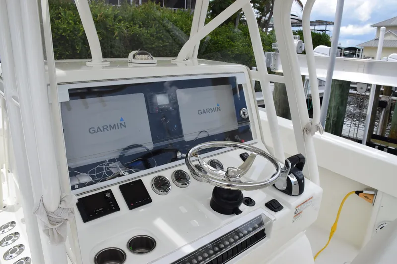 Slide: The Image of 2017 SeaVee 370z boat dashboard with Garmin navigation system and steering wheel. - 8