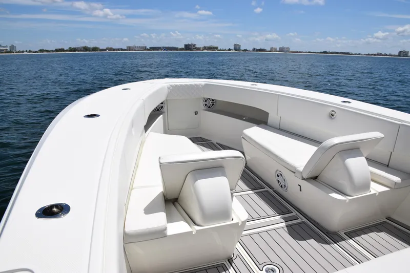 Slide: The Image of 2017 SeaVee 390Z boat with spacious seating on calm ocean waters. - 12