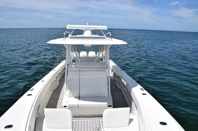 Slide: The Image of 2017 SeaVee 390Z boat on open water, showcasing sleek design and spacious deck. - 16