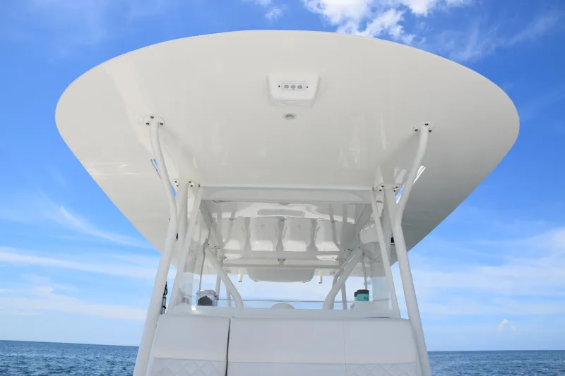 Slide: The Image of 2017 SeaVee 390Z boat canopy against a clear blue sky. - 21