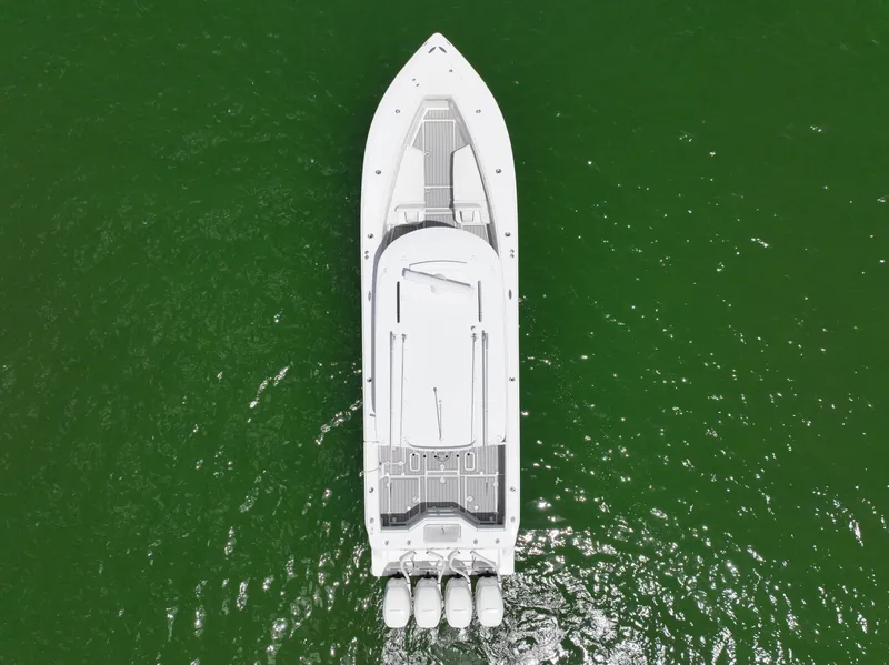 Slide: The Image of Aerial view of 2017 SeaVee 390Z boat on green water. - 3