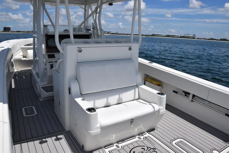 Slide: The Image of 2017 SeaVee 390Z boat interior with seating, ocean view, and clear skies. - 33