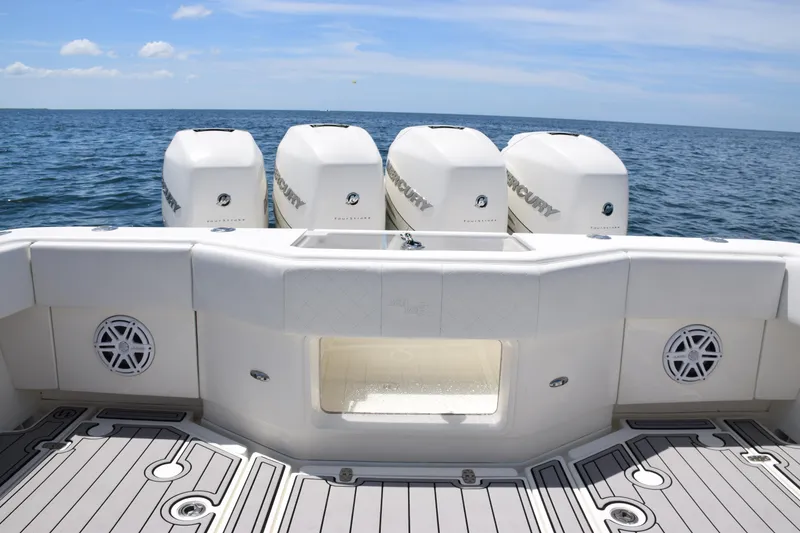 Slide: The Image of 2017 SeaVee 390Z boat with four powerful outboard engines on open water. - 38