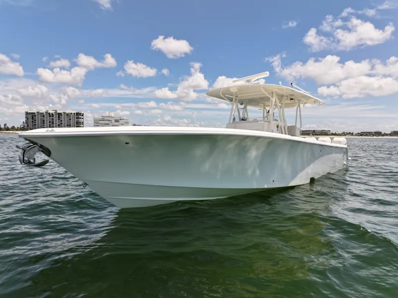 Slide: The Image of 2017 SeaVee 390Z boat on calm water under a partly cloudy sky. - 4