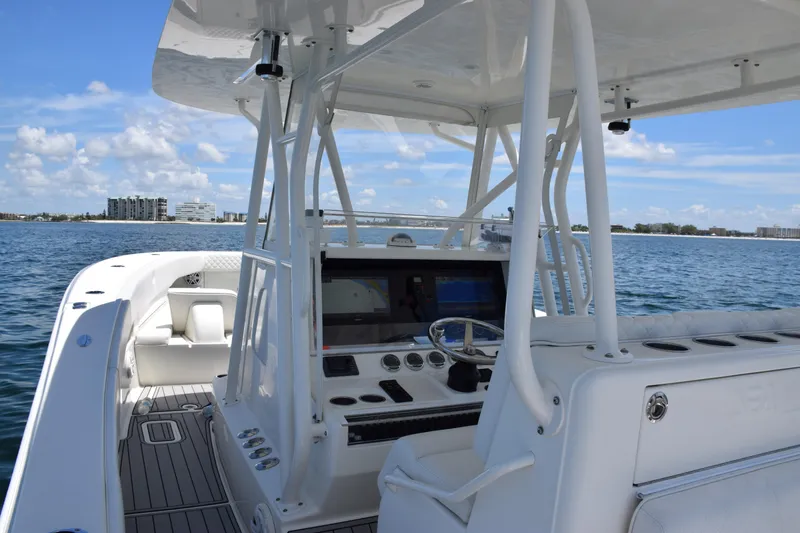 Slide: The Image of 2017 SeaVee 390Z boat interior with helm, ocean view, and clear sky. - 40
