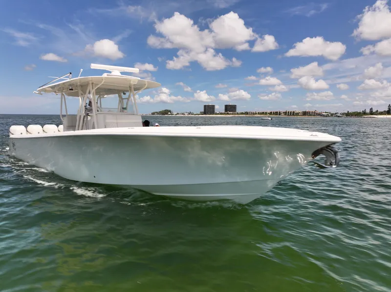 Slide: The Image of 2017 SeaVee 390Z boat on calm water under a clear blue sky. - 43