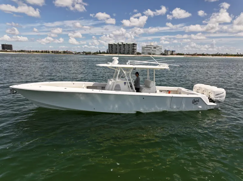 Slide: The Image of 2017 SeaVee 390Z boat on calm water with cityscape background. - 7