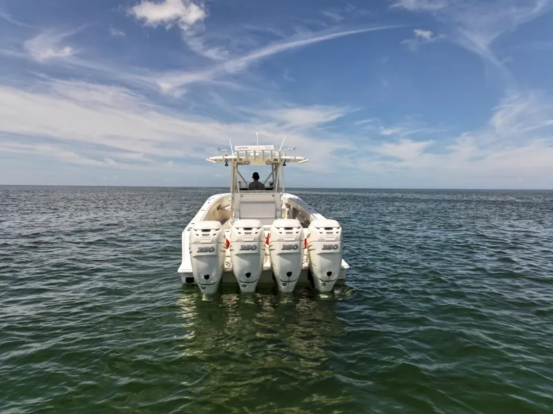 Slide: The Image of 2017 SeaVee 390Z boat with four engines on open water under a blue sky. - 8