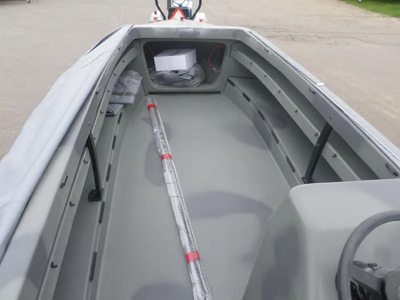 Slide: The Image of 2024 Bankes Crusader 19 boat interior with storage compartments and steering console. - 3