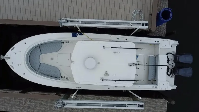 Slide: The Image of Aerial view of a 2007 Edgewater 318CC boat docked at a marina. - 17