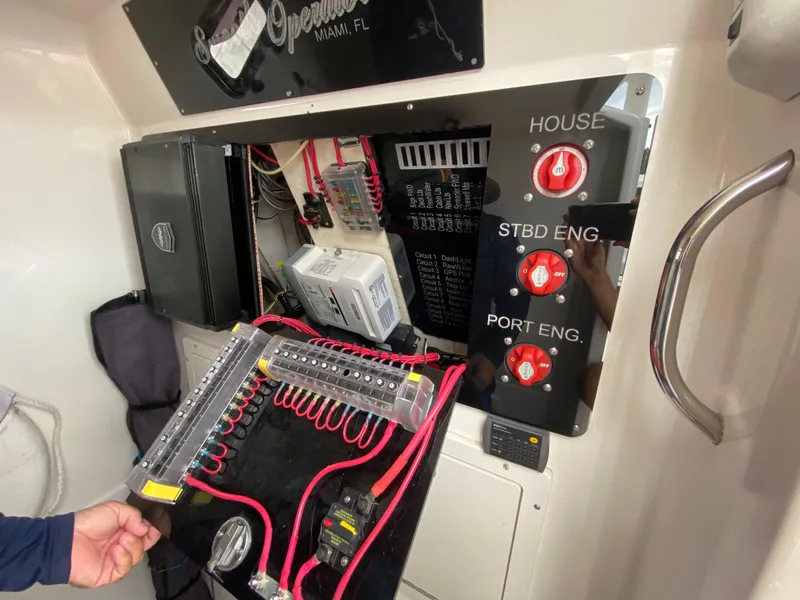 Slide: The Image of Electrical panel of a 2007 Edgewater 318CC boat with wiring and switches. - 21