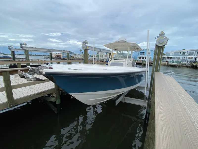 Slide: The Image of 2007 Edgewater 318CC boat docked at marina with overcast sky. - 8
